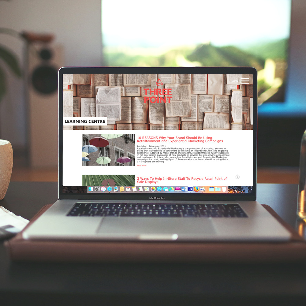 The Three Point Learning Centre article listing shown on a laptop.