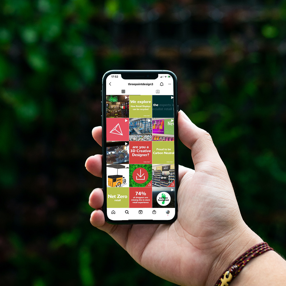 The Three Point Design Instagram grid shown on a phone.